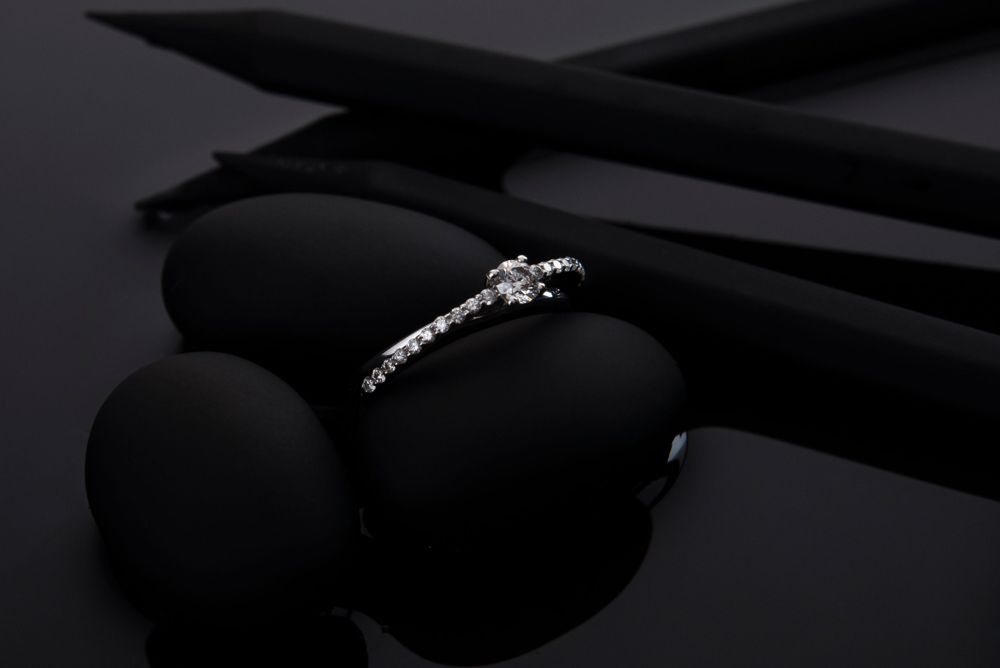 Small round diamond solitaire with a graduated pavé band in white gold
